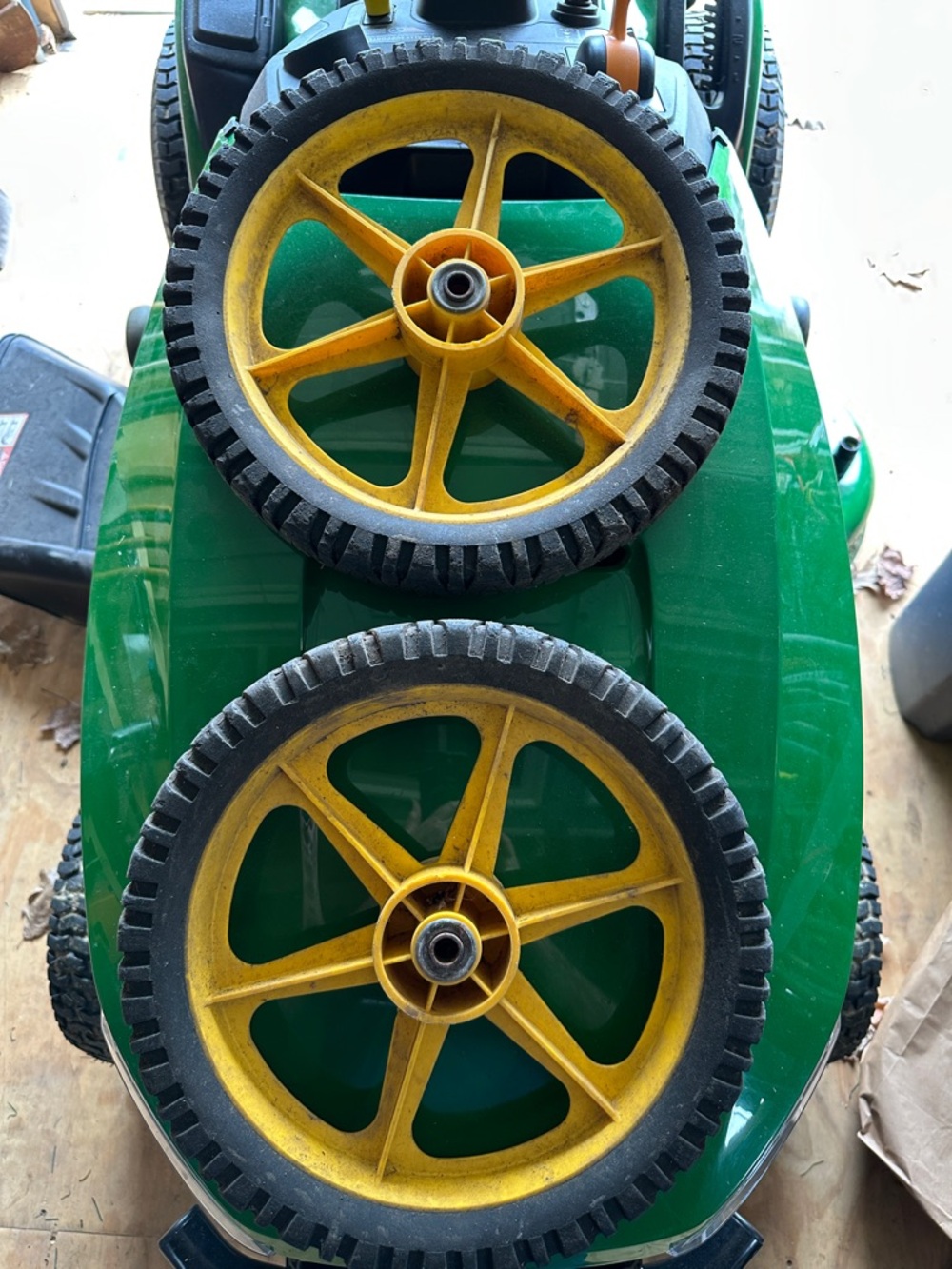 Two lawnmower wheels